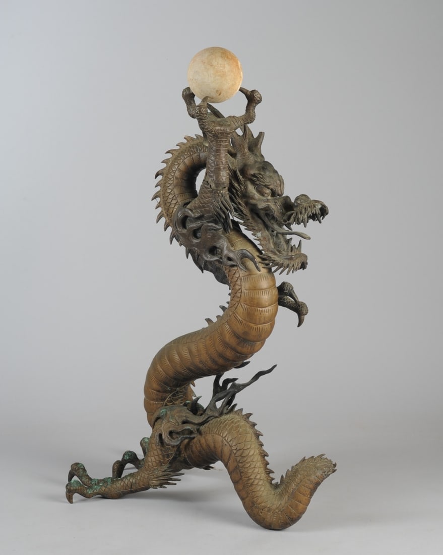 Large Antique Bronze Dragon, Meiji, Japan: Writhing bronze three-toed dragon okimono, very detailed with flames, scales, sharp teeth and protruding tongue, holding a marble (or similar stone) "pearl". No signature found. Losses to tips of two 