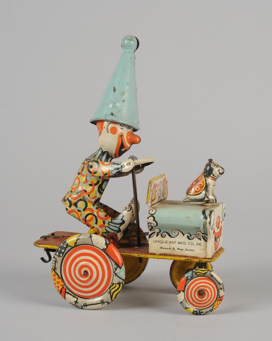 Unique Art Tin Litho Wind Up Artie Clown Car: Minor losses, in need of cleaning, wind up mechanism not fully functionally / works intermittently.H: approx. 9 1/4".L: approx. 7".W: approx 3 3/4". Provenance: the estate of John Long, highly regarde
