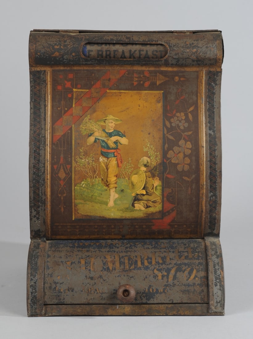 General Store Tin Litho Tea Bin Counter Display: J. H. Merrill Co. tin litho counter display for tea and coffee; a window at the top of the display allows the merchant to change the description of the contents of the bin; options are: E. BREAKFAST, 