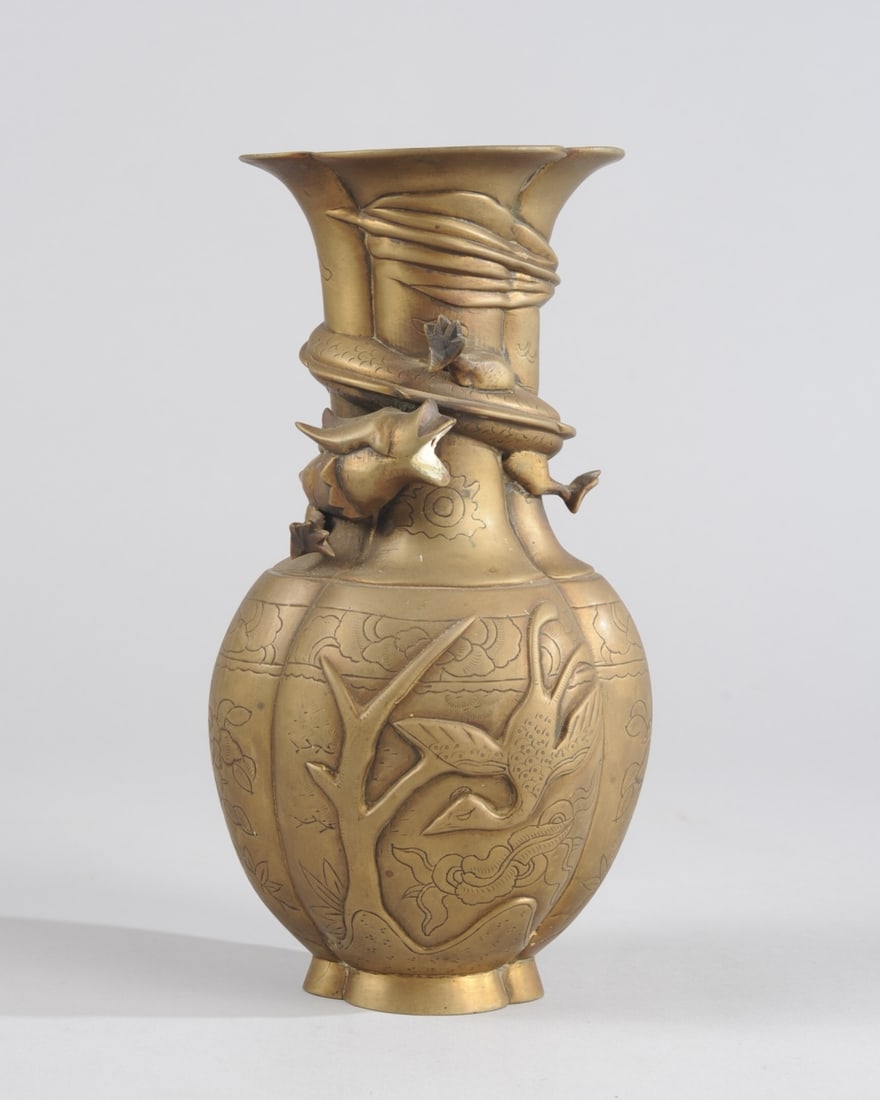 Chinese Brass Dragon Vase: Lobed lotus form vase, the neck wrapped with a five-toed dragon, the lower part with relief phoenix and deer, and with incised auspicious symbols. Approx. 9 1/2" H. Provenance: the estate of John Long