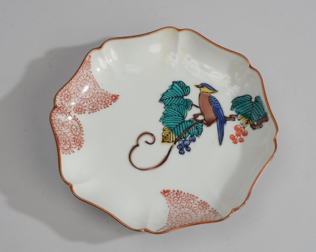 Japanese Kutani Dish: Ko-Kutani style dish, bird in flowering branches, Meiji period. Kutani mark. Approx. 6" x 6".
