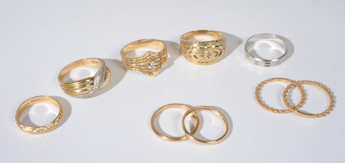 Nine 14K Yellow & White Gold Rings: Sizes include approx. 10, 8 1/2, 9 3/4, 7 1/2, 8, 7 1/2, 8 3/4, 9, 9 3/4. Total weight: approx. 27.3 grams.