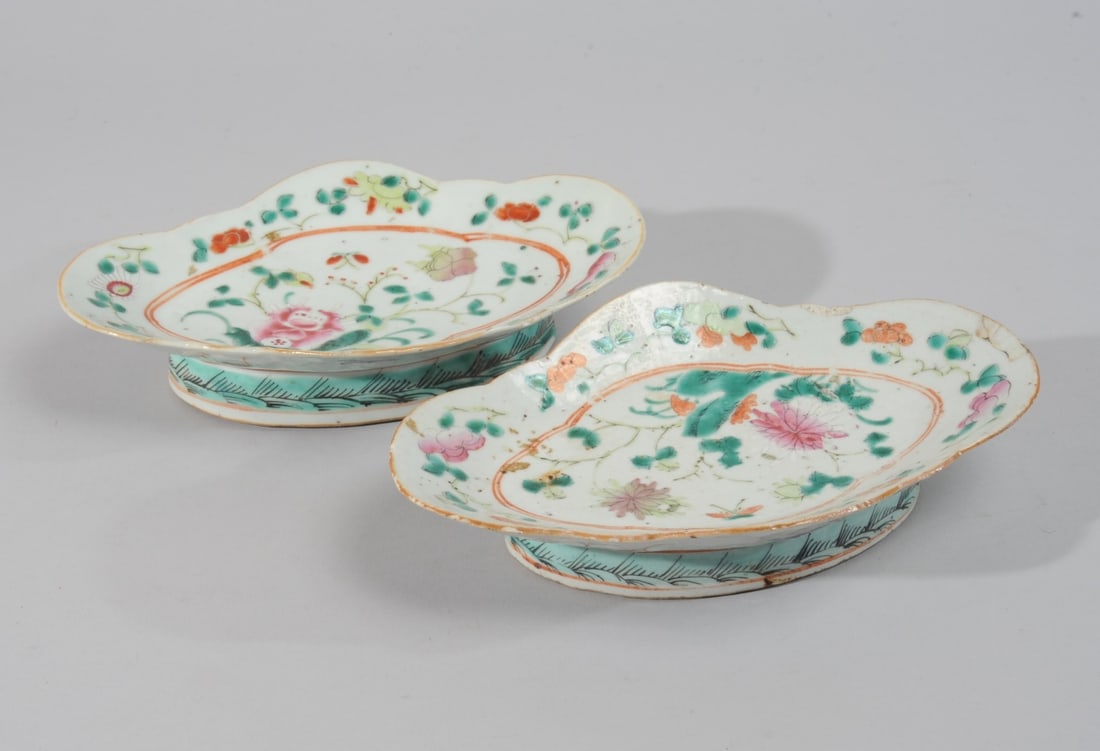 Pair Chinese Famille Rose Footed Dishes: Late Qing - Republic period porcelain oblong footed dishes with lobed rim, with flowers and butterflies in famille rose enamels, with flowers and auspicious bats to exterior. Both with four-character 