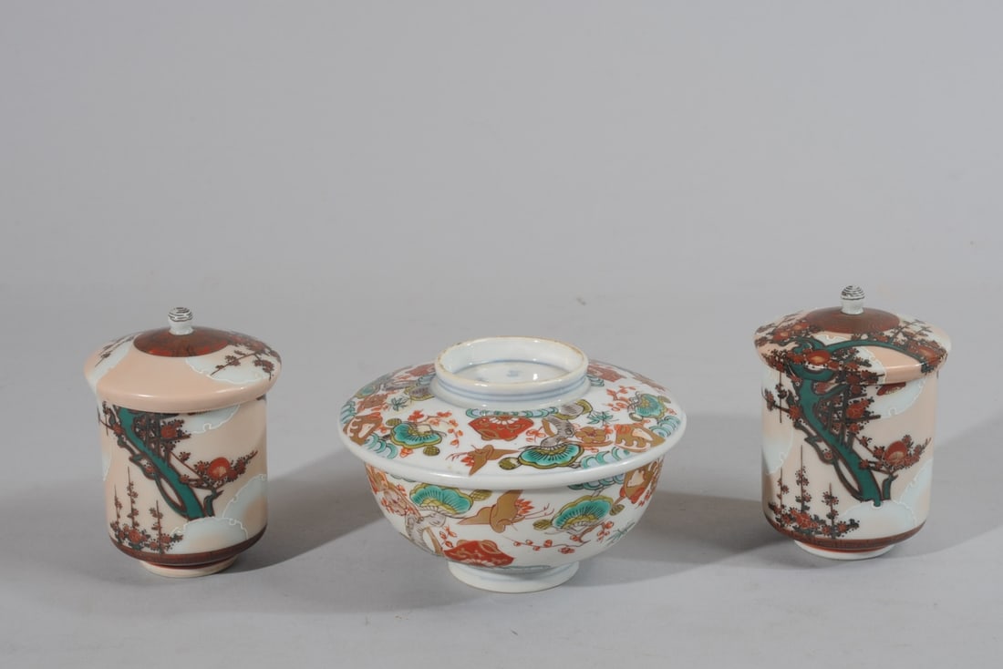 Imari and Kutani Covered Bowl & Cups: Lot includes an Arita Imari bowl and cover decorated in the Imari palette with flowering trees and cranes. Cover with four-character Fuki Choshun mark in underglaze blue. Offered together with a pair 