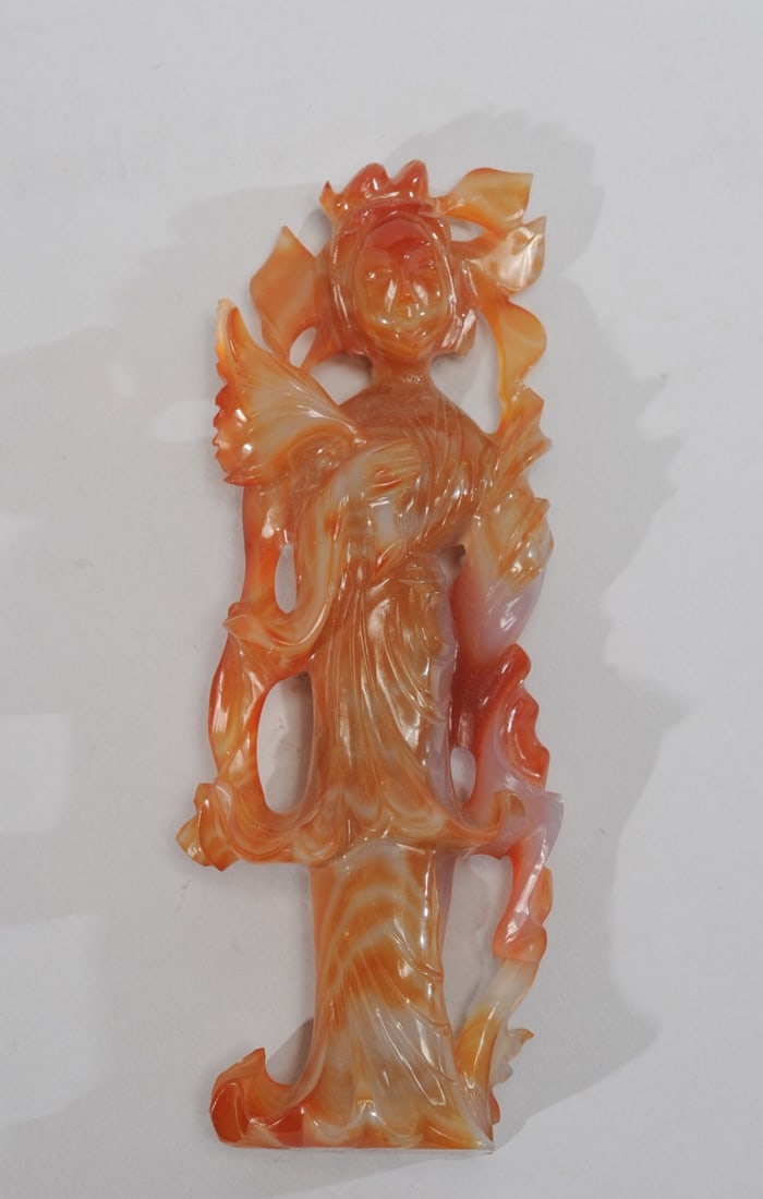Chinese Carved Agate Guanyin: Figure of Guanyin, goddess of compassion, carved from amber colored agate. Approx. 7" H.