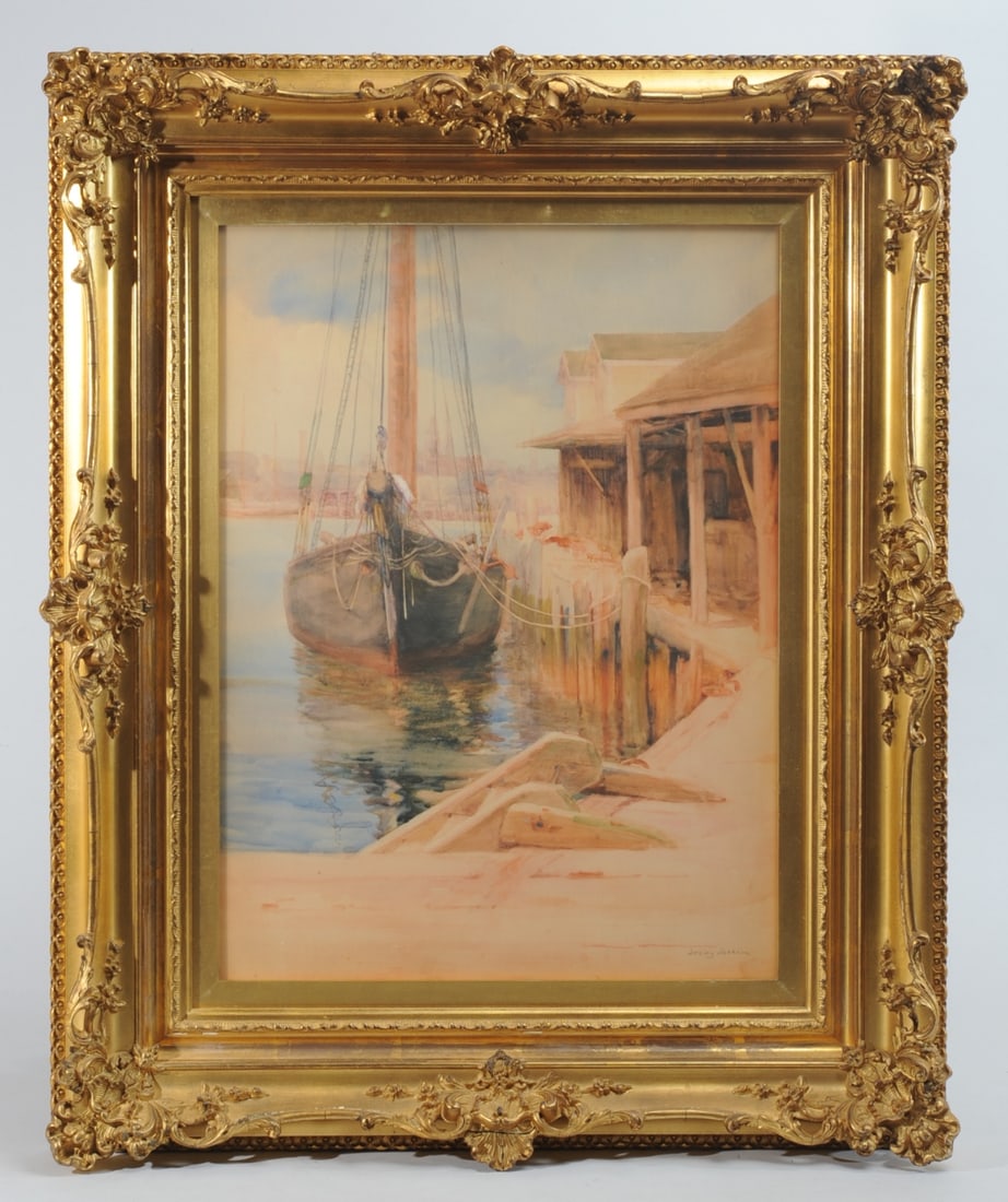 Lesley (Elizabeth) Jackson (1866 - 1958): Watercolor of a sailboat at a dock, with rustic harbor buildings. Signed lower right: Lesley Jackson. The Minnesota and Washington, D. C. artist is known for watercolor and printmaking. 19th c. gilt g