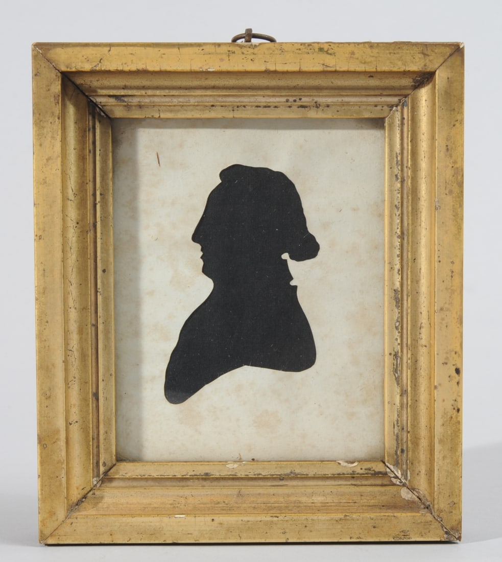 Early 19th C. Hollow Cut Silhouette: Hollow-cut silhouette over black fabric showing a portly gentleman in profile. Gilt wood frame with early glass. Frame approx. 6 5/8" x 5 5/8".