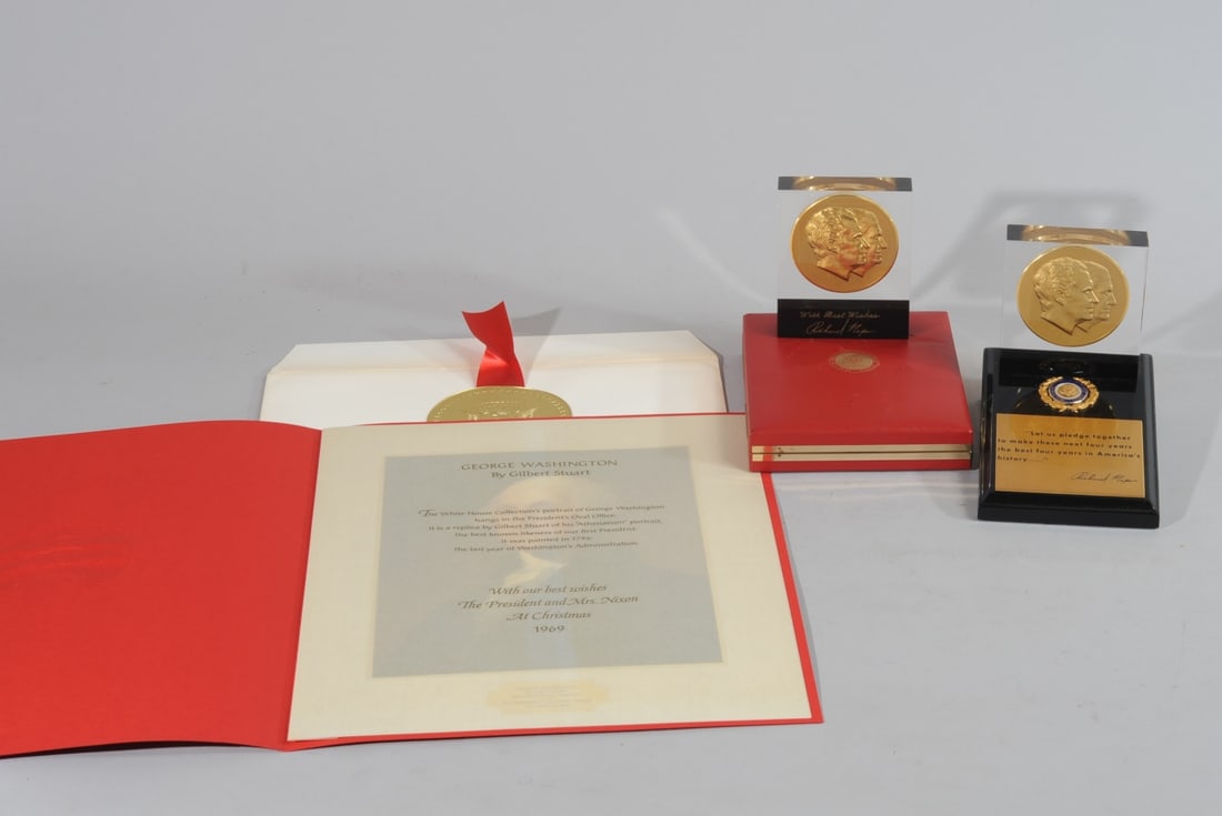 Richard Nixon & Spiro Agnew 2nd Term Medallions+: Two bronze medallions commemorating the second inauguration of Richard Nixon and Spiro Agnew, both in lucite, one mounted to stand with presidential seal, the other in original box (some damage to box