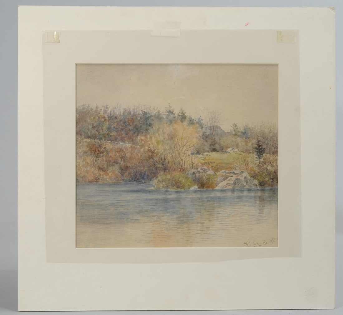 Harry Elliot Sylvester (Massachusetts, 1860-1921): Watercolor on paper showing a landscape across water, by Harry Elliot Sylvester, known for his watercolors depicting Massachusetts scenery. Signed lower right: H. E. Sylvester and dated 1887. Matted b