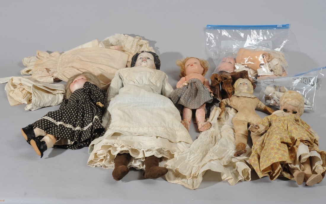 Antique Doll Parts Lot: Lot includes: an Armand Marseille 390 German bisque head doll--all parts present including wig, clothing and shoes, but completely disassembled, damage to one eye and loss of fingertips on one hand; A