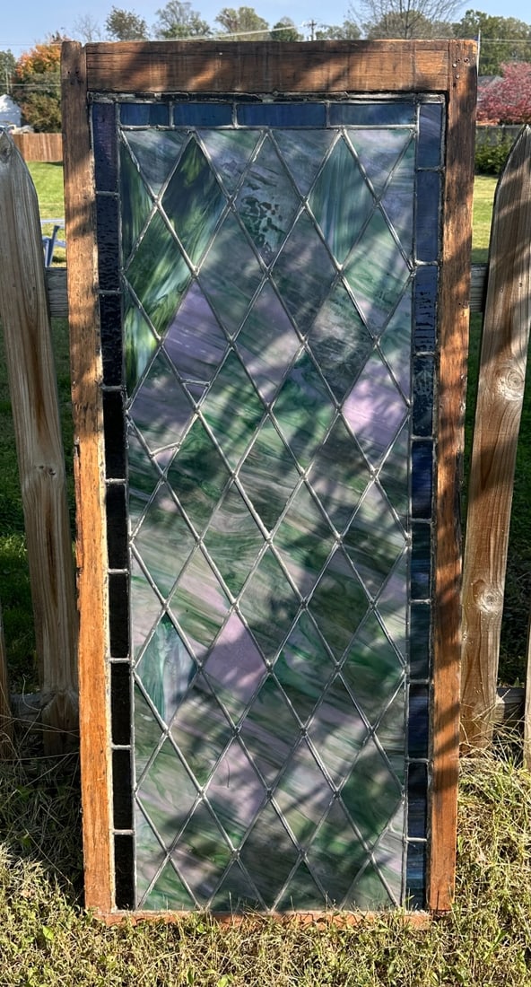 20th C. Stained Glass Door: Some minor cracks, weathering and wear. Approx. 64 1/4" x 28".