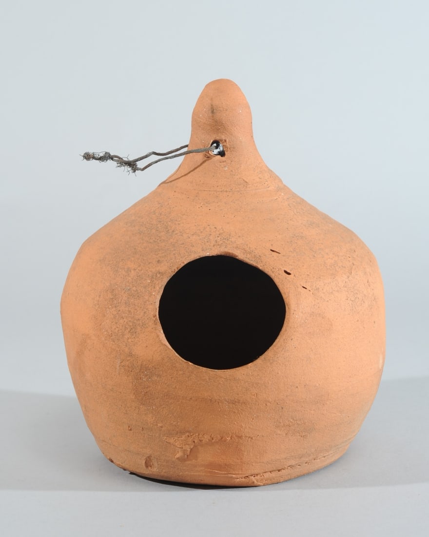 Southern (Ga.) Pottery Redware Birdhouse: Hewell's Pottery redware hanging birdhouse. Impressed mark to base: Hewell's / Pottery / Gillsville Ga. Approx. 8 1/4" H., 7" D. Provenance: the estate of John Long, highly regarded Virginia antiques 