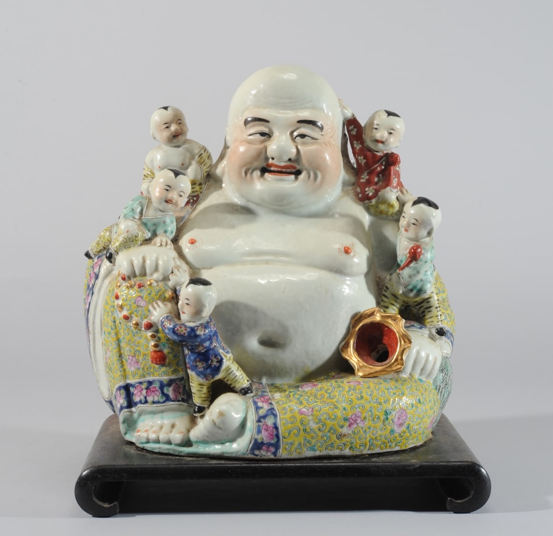 Chinese Porcelain Famille Rose Hotei w Little Boys: UPDATE 10-23: GLAZE FLAKE, ADDED PHOTO Aka the laughing Buddha, with six playful boys. Mounted to wood stand. He holds a string of prayer beads in one hand and the end of a large sack in the other. T