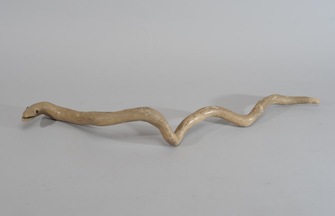 Vintage or Antique Folk Art Snake: Painted wood folk art snake with carved open mouth, square metal nuts for eyes. Approx. 27" L. Provenance: the estate of John Long, highly regarded Virginia antiques dealer and collector.