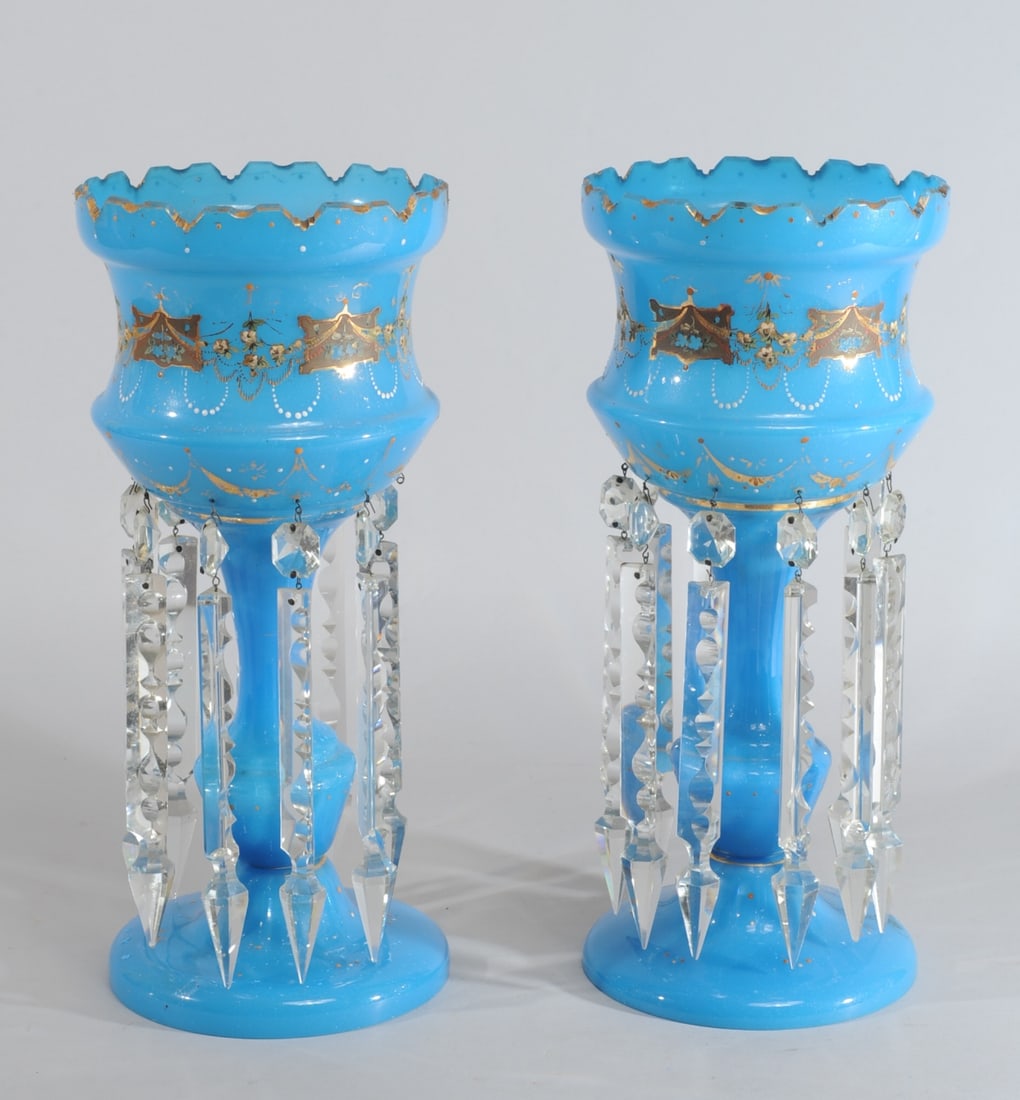 Pr. French Blue Opaline Glass Lustres: Blue opaline glass with enamel and gilt. One lustre has its complete set of ten prisms, the other is missing one and so only has nine. Approx. 16 1/8" H, 7" D. Provenance: the estate of John Long, hig