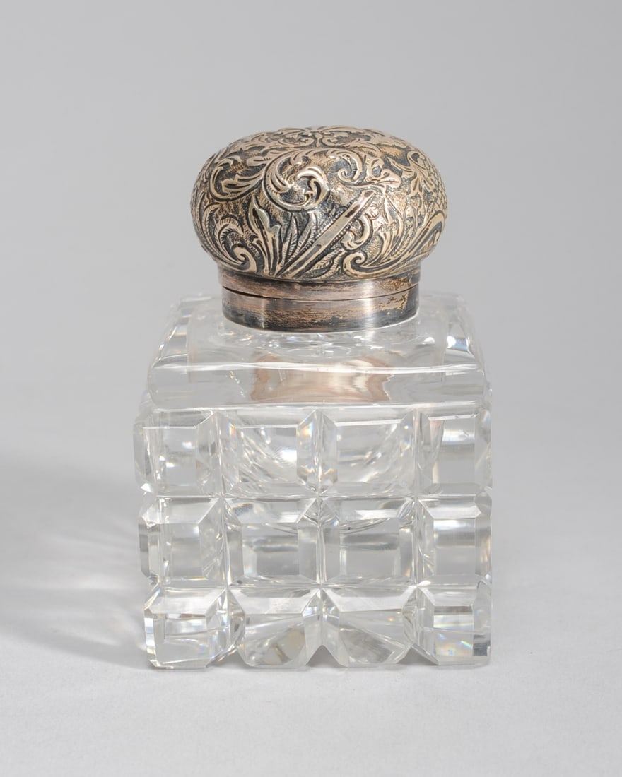 Cut Glass Inkwell with English Sterling Top: Top has some dents and detaches from inkwell. H: approx. 4 1/4". W: approx. 2 3/4". D: approx. 2 3/4".