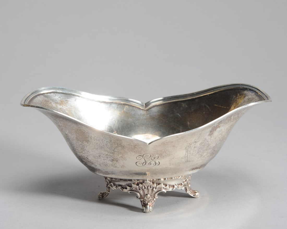 Tiffany & Co. Sterling Silver Sauce Boat: Circa 1910, monogrammed, marked to underside. H: approx. 3 1/8". L: approx. 7 1/4". D: approx. 4 1/8". Weight: approx. 5.94 ozt.