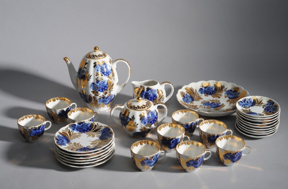 Lomonosov Golden Garden Dessert Service: 20th century, hand painted, marked for Lomonosov and Made in USSR, one teacup shows rim chip, 28 pieces total.
