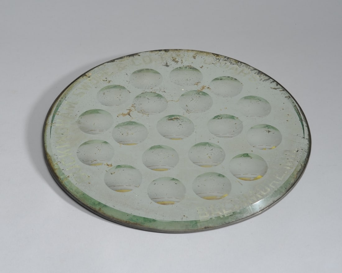 Buckingham, Swope & Co. Advertising Mirror: Advertising mirror for Buckingham, Swope & Co. Fine Cigars, Baltimore, Md. 19 small convex mirrors within a larger mirror, some losses and scratching. Dia: approx. 11". Provenance: the estate of John