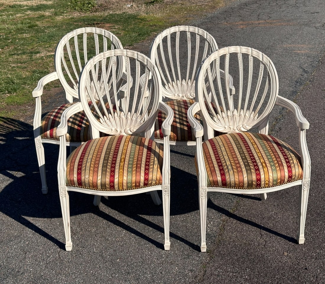 4 Councill French Country Style Armchairs: Carved openwork back, serpentine arms, upholstered seats with nailhead trim, straight square legs with rosette carved elements. Distressed white painted surface. Multi striped brocade fabric in excell