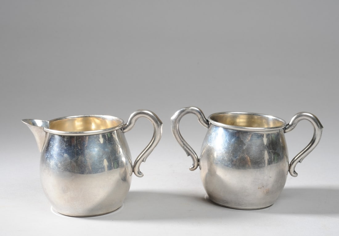 Sterling Silver Sugar & Creamer: No monograms, both marked to underside for M.F.H. (M Fred Hirsch), dent to one sugar handle. H (both): approx. 3 1/4", sugar approx. 5" from handle-to-handle. Total weight: approx. 5.65 ozt.