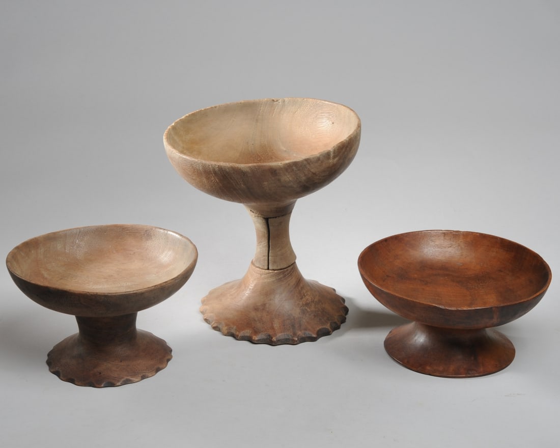 Three Toraja Bowls (Dulong) Sulawesi: Three pedestal / waisted bowls or cups, the largest made in three interlocking pieces. Two with fluted base rim. Sizes are 9" H x 9" D, 5" H x 8" D, and 4" H x 8 1/4" D. Provenance: From a private Vir