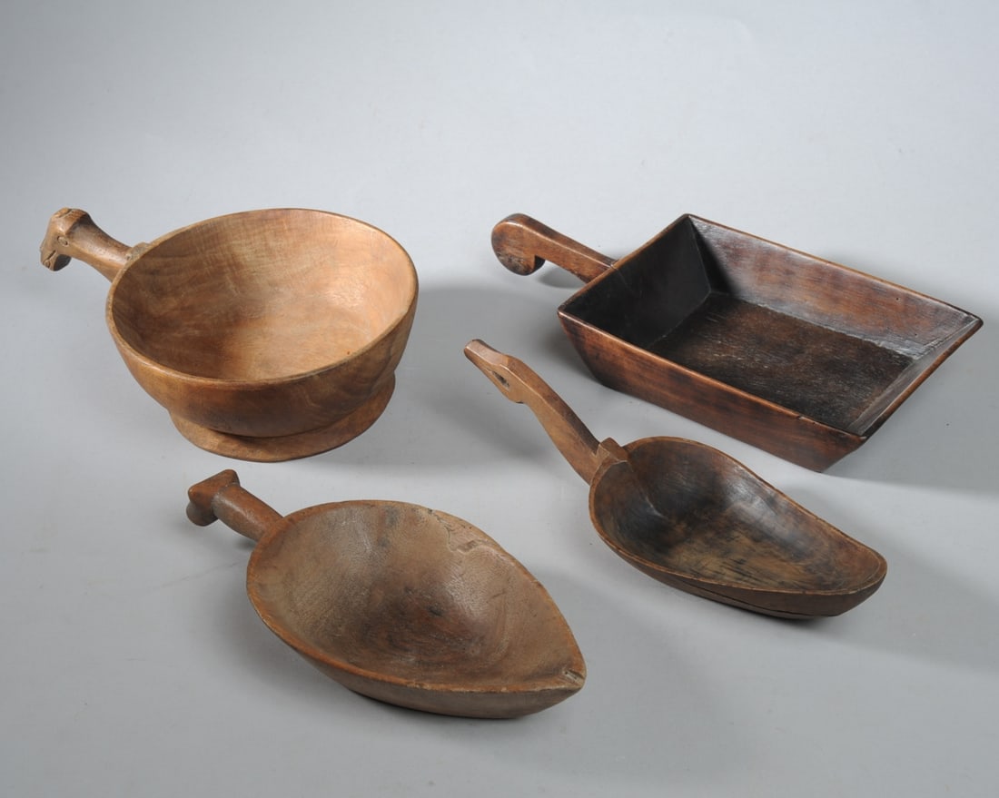 Four Toraja Bowls, Zoomorphic Handles: Lot to include: a round bowl on low foot with horse ? or other animal head handle; a leaf-shaped bowl with stylized cow head handle; a leaf shaped bowl with handle possibly in the form of a stylized b