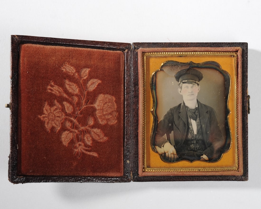 Daguerreotype of Young Man in Wheel Cap: Ninth plate daguerreotype of a young man wearing a wheel cap, as worn by antebellum and wartime military and civilian men including mechanics, boatmen, teamsters, and others in both the North and the 