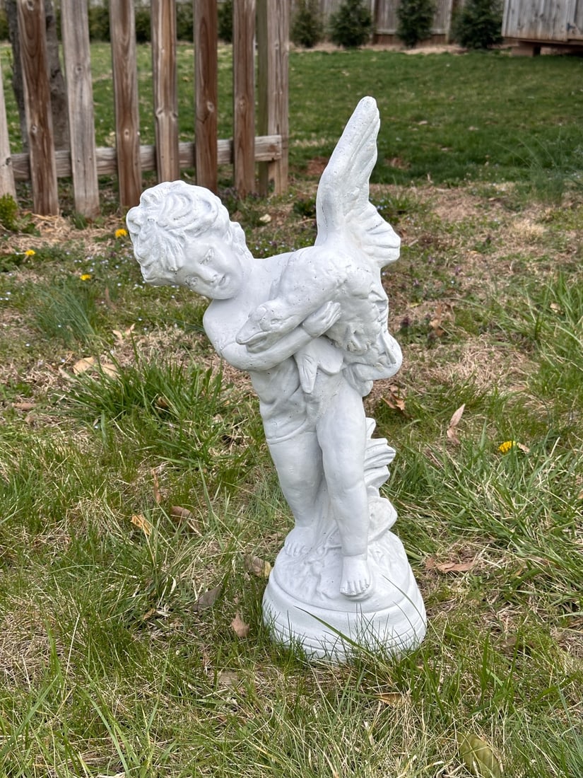 Statue of Girl Holding Duck: Garden or indoor statue of small girl holding a duck or goose. White painted cast stone or similar material. Approx. 12 1/2" x 9" x 27" H.