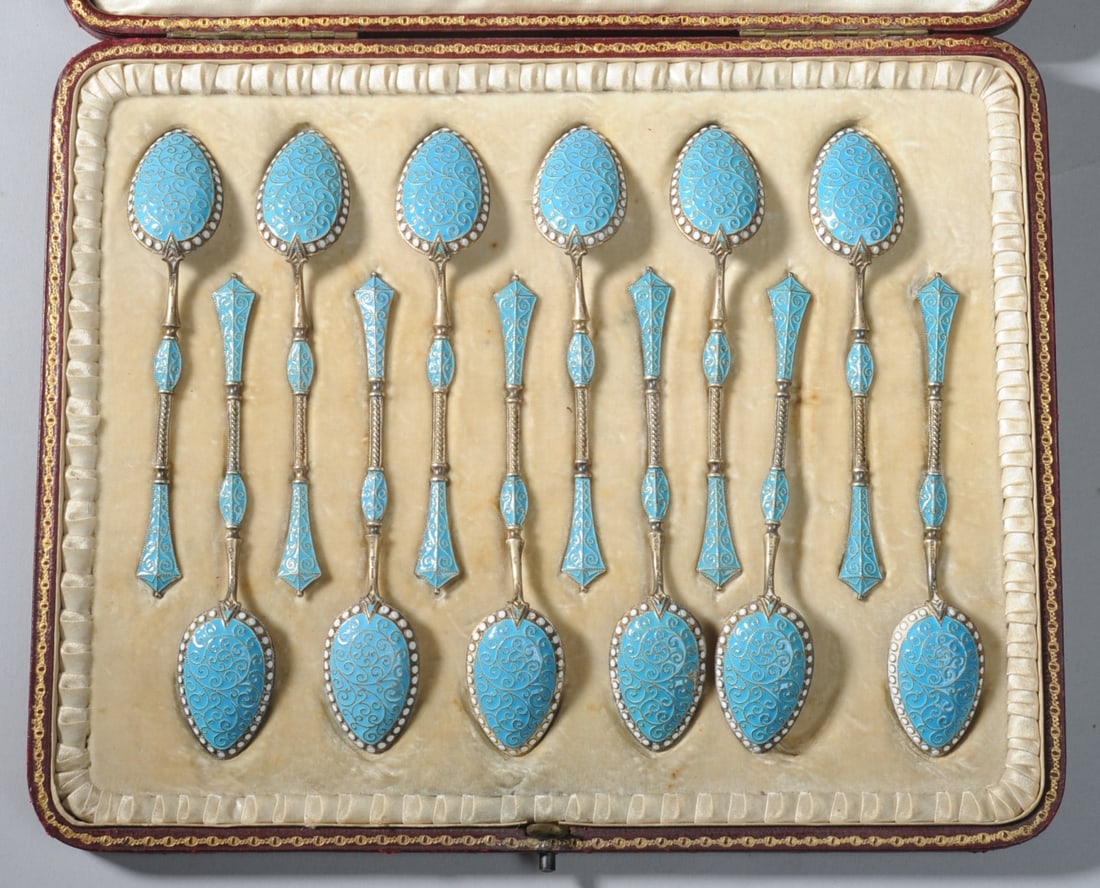 12 Enamel-Decorated Demitasse Spoons: Spoons marked ECK and Norway, in fitted case marked for Dobson & Sons (London). Spoon L: approx. 4 1/4". Case: approx. 9" x 7 1/4" x 1".