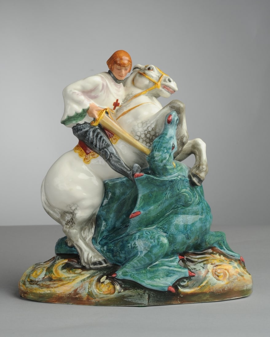 Royal Doulton Porcelain St. George and the Dragon: Marked to underside, HN 2051, no visible chips, cracks or repairs. Approx. 7 1/2" x 7 1/4" x 3 1/4". Seamless shipping is available through LiveAuctioneers at checkout, but you are welcome to arrange 