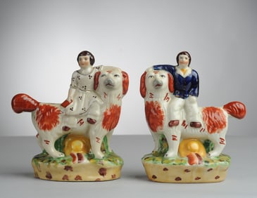 Two Staffordshire Figures, Boy & Girl on Spaniel