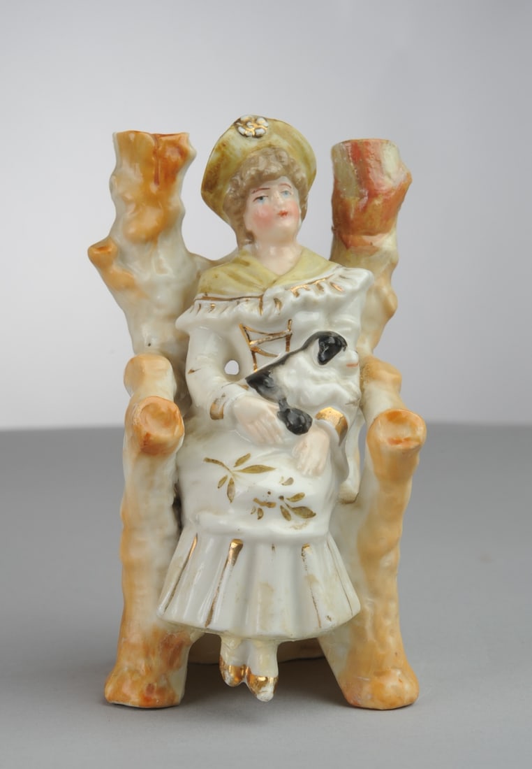 Continental Spill Vase, Seated Woman with Dog: Minor chips. H: approx. 5". W: approx. 2 3/4". D: approx. 2 1/2". Seamless shipping is available through LiveAuctioneers at checkout, but you are welcome to arrange your own shipping if you prefer—m