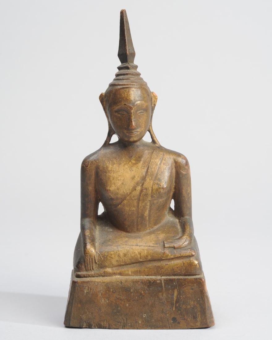 19th C. Burmese Carved Gilt Wood Buddha: Seated Buddha figure on trapezoidal base. Simply but delicately carved, much original gilt remains. Lustrous patina. Minor losses to tip of the ushnisha, chip to top of ear, possible old repair to elo