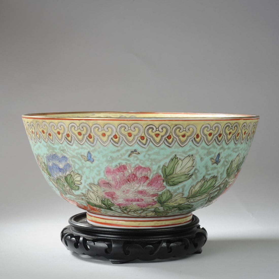 Vintage Chinese Macau Porcelain Center Bowl: Large bowl with floral decoration in thick, pale enamels typical of Macau decorated porcelain. While still considered Chinese, the label to base says "Japanese Ware Porcelain Decorated in Macau". Tong