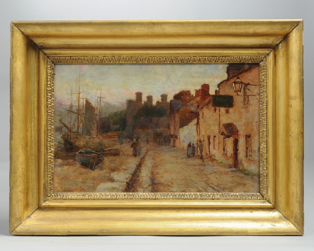 Tom Clough (1867-1943) Conway, N. Wales: Oil on canvas painting showing a scene in Glan Conway, North Wales, with figures on a cobblestone street by a harbor at dusk, the Conway castle walls in shadow in the distance. Signed lower left: T. C