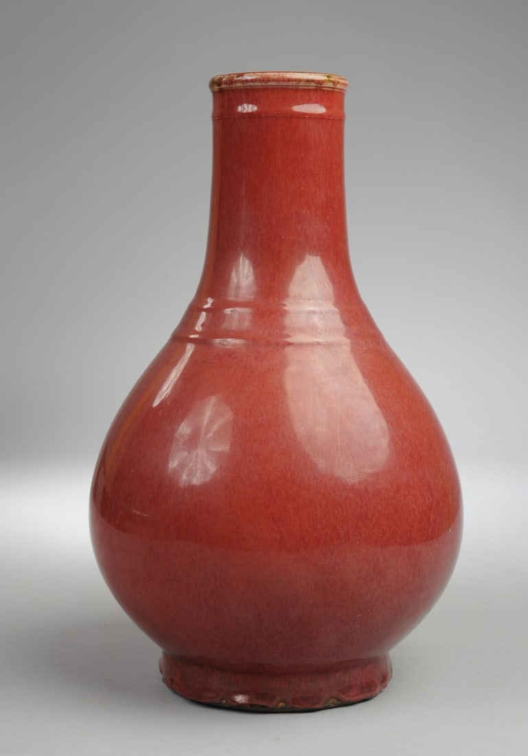 Chinese Copper Red Porcelain Vase: H: approx. 13 1/2". Seamless shipping is available through LiveAuctioneers at checkout, but you are welcome to arrange your own shipping if you prefer—many bidders find this can be the more economic