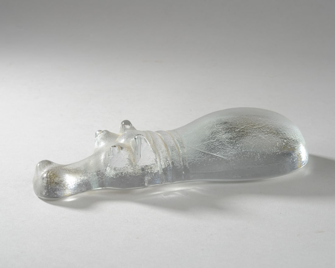Kosta Boda Art Glass Submerged Hippo: Possibly Erik Hoglund & Bertil Vallien. Label missing. Excellent condition. Approx. 2 5/8" x 1 1/2' x 7 1/2" L. Seamless shipping is available through LiveAuctioneers at checkout, but you are welcome