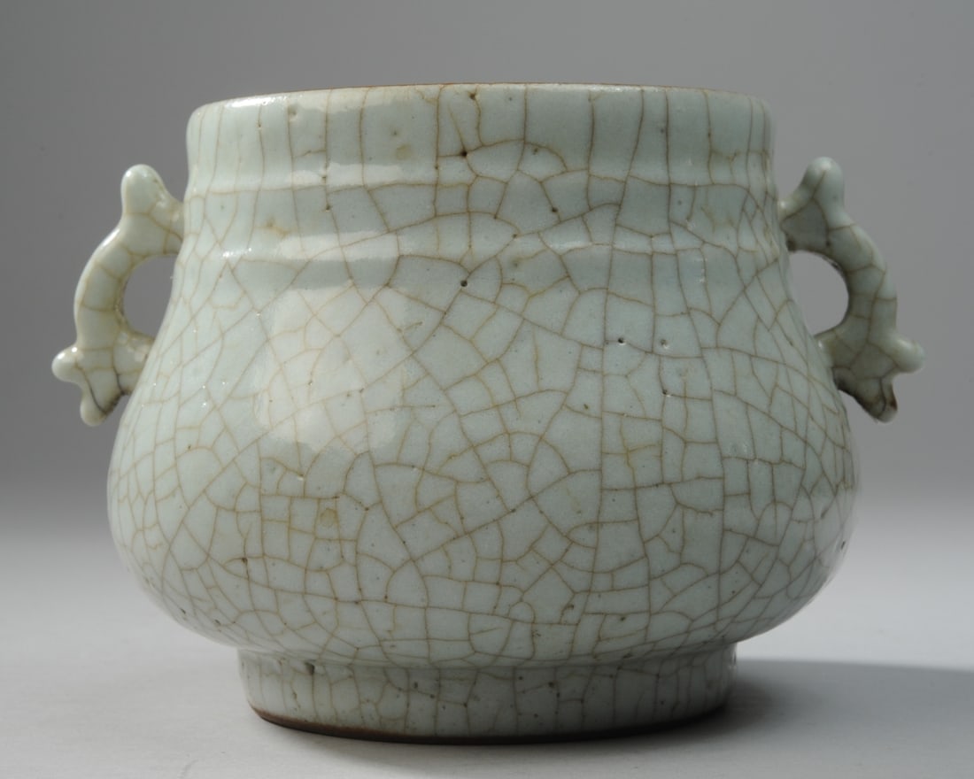 Chinese Yuan Glazed Porcelain 2-Handled Jar: With iron brown glazed rim. H: approx. 4 1/4", approx. 6" from handle to handle. Seamless shipping is available through LiveAuctioneers at checkout, but you are welcome to arrange your own shipping if