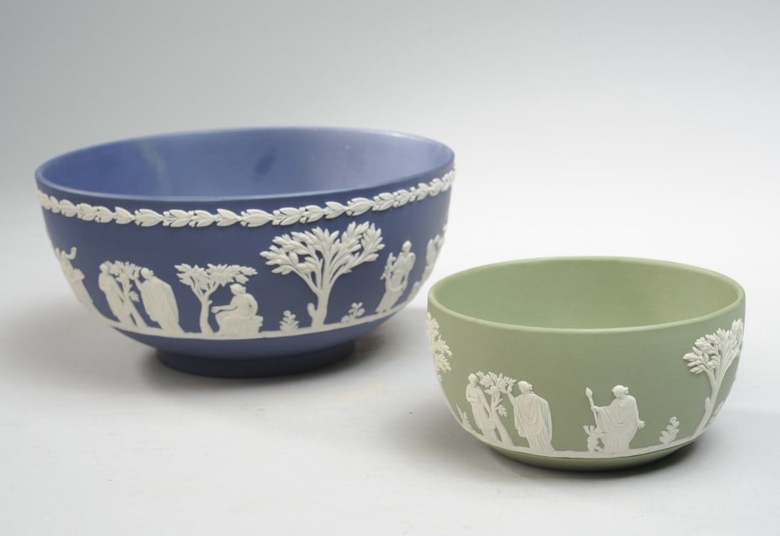 Two Wedgwood Jasperware Bowls: Larger blue jasperware bowl with smaller green bowl, both marked to underside, no visible chips, cracks or repairs. Blue bowl H: approx. 3 3/4", dia: approx. 7 3/4". Green bowl H: approx. 2 1/2", dia: