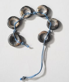 Seven Han Dynasty Black Jade Discs or Beads