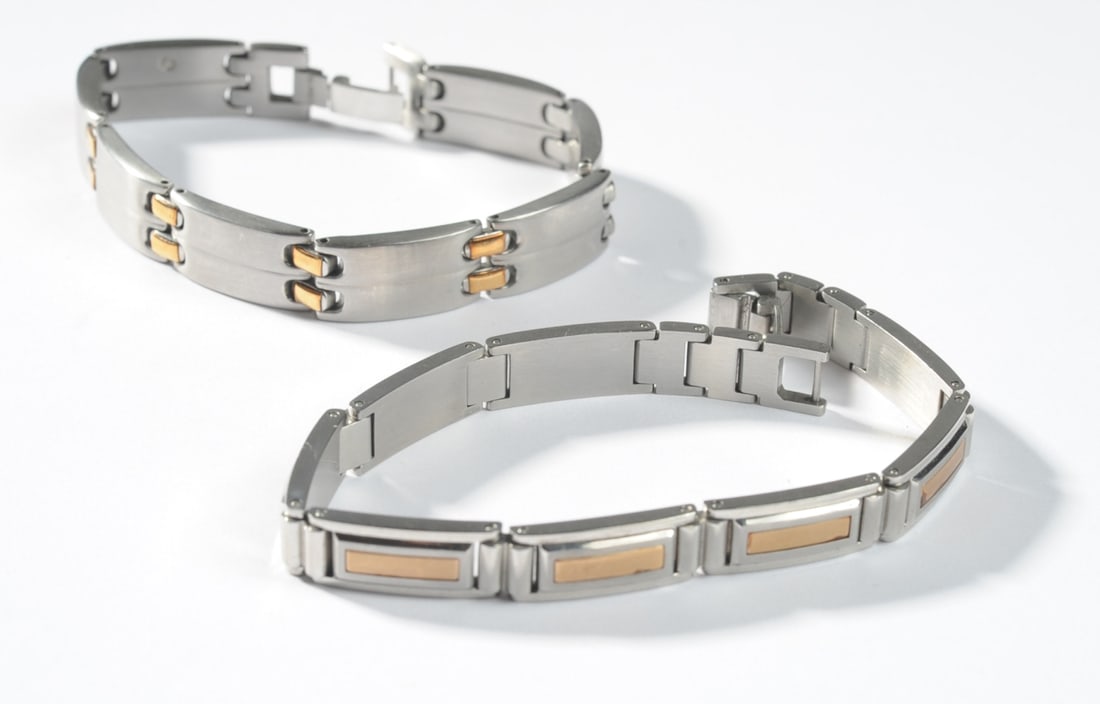 Two Stainless Steel & 14K Gold Bracelets: Two stainless steel bracelets with 14K gold accents, both probably from the I.B. Goodman STEL line. Both marked stainless and 14K. Longest: approx. 8". PLEASE NOTE: First-time buyers of gold or silver