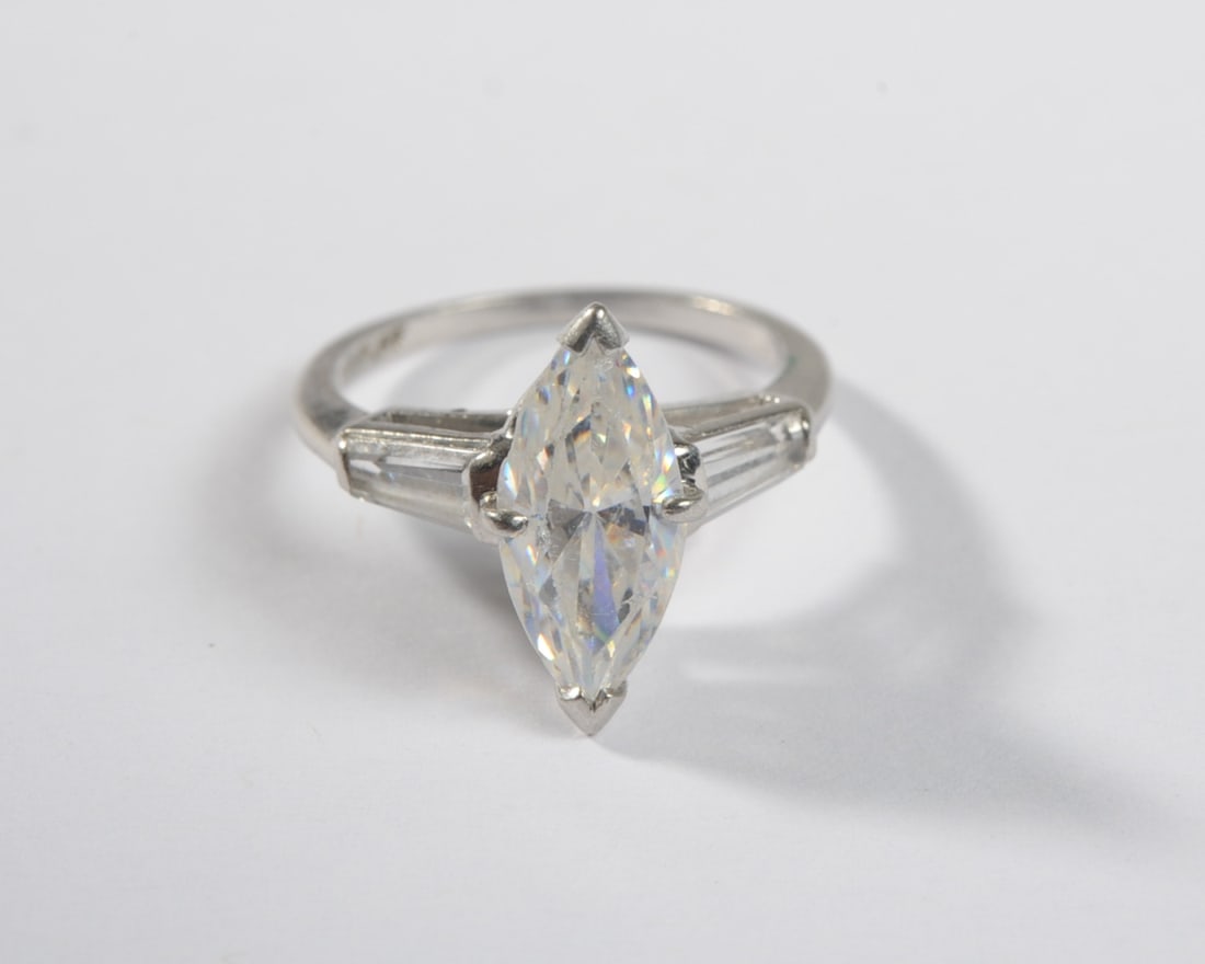 Platinum & Cubic Zirconia Ring: Size 5. Weight: approx. 4.2 grams. PLEASE NOTE: First-time buyers of gold or silver may be required to pay by check or bank wire transfer; Credit card payments may not be accepted for these transactio