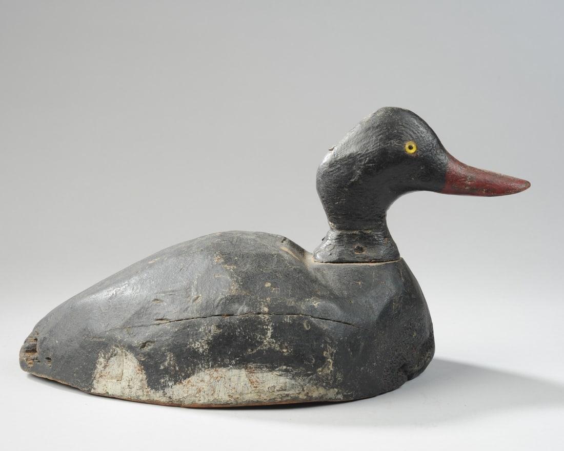 Carved Duck Decoy: Circa 1940s, with glass eyes, unsigned. H: approx. 7 1/2". L: approx. 14 1/2". W: approx. 7". Our primary recommendation is to arrange shipping yourself using Blue Ridge Pack & Ship. Most bidders find