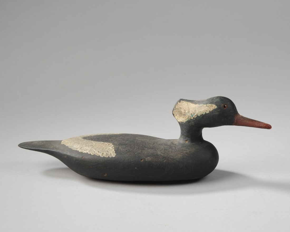 Hooded Madagascar Drake Decoy: Incised to underside "MBR" or "MUR". H: approx. 4 1/4". L: approx. 13 1/2". W: approx. 3 3/4". Our primary recommendation is to arrange shipping yourself using Blue Ridge Pack & Ship. Most bidders fin