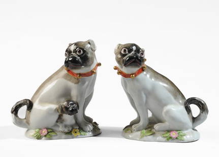 Pair Meissen Style Ceramic Pugs: On bases with applied flowers, one with a small puppy. Bell studded collars, curled tails. Both with hand painted "Made in France" mark to base. Both with Meissen style marks in underglaze blue to