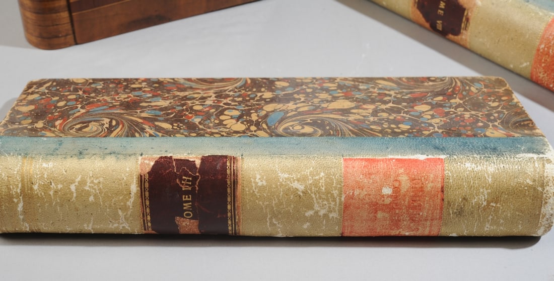 Vintage Faux Books: Pair of vintage faux wooden books, the gold stamped leather spines and marbled boards apparently taken from antique books. Offered together with a vintage marquetry box in the form of a book, the fron