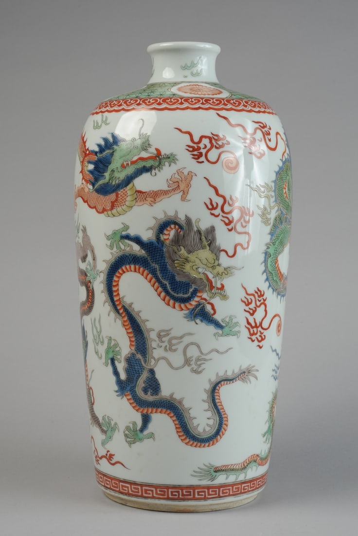 Chinese Porcelain Meiping Vase: With famille verte 5 dragon decoration, kanxi mark on base. H: approx. 15". Dia: approx. 5 3/4". Our primary recommendation is to arrange shipping yourself using Blue Ridge Pack & Ship. Most bidders f