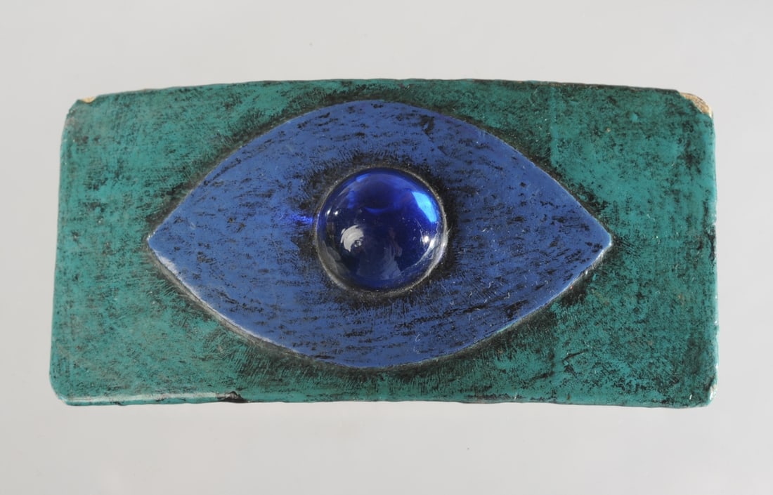 Vintage 1960s Fred Sexton Nube Blanca Belt Buckle: Blue and green enameled buckle with blue glass cabouchon. Signed to verso in ink: Nube Blanca / Fred Sexton / Mexico". The artist was known, among other things, for crafting the figure of the Falcon f