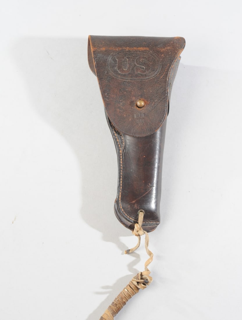 World War I Era US Military Pistol Holster: Marked US and M.O.D. 1918, wear appropriate for age and use. Approx. 10" x 5" x 1 3/4". Our primary recommendation is to arrange shipping yourself using Blue Ridge Pack & Ship. Most bidders find this